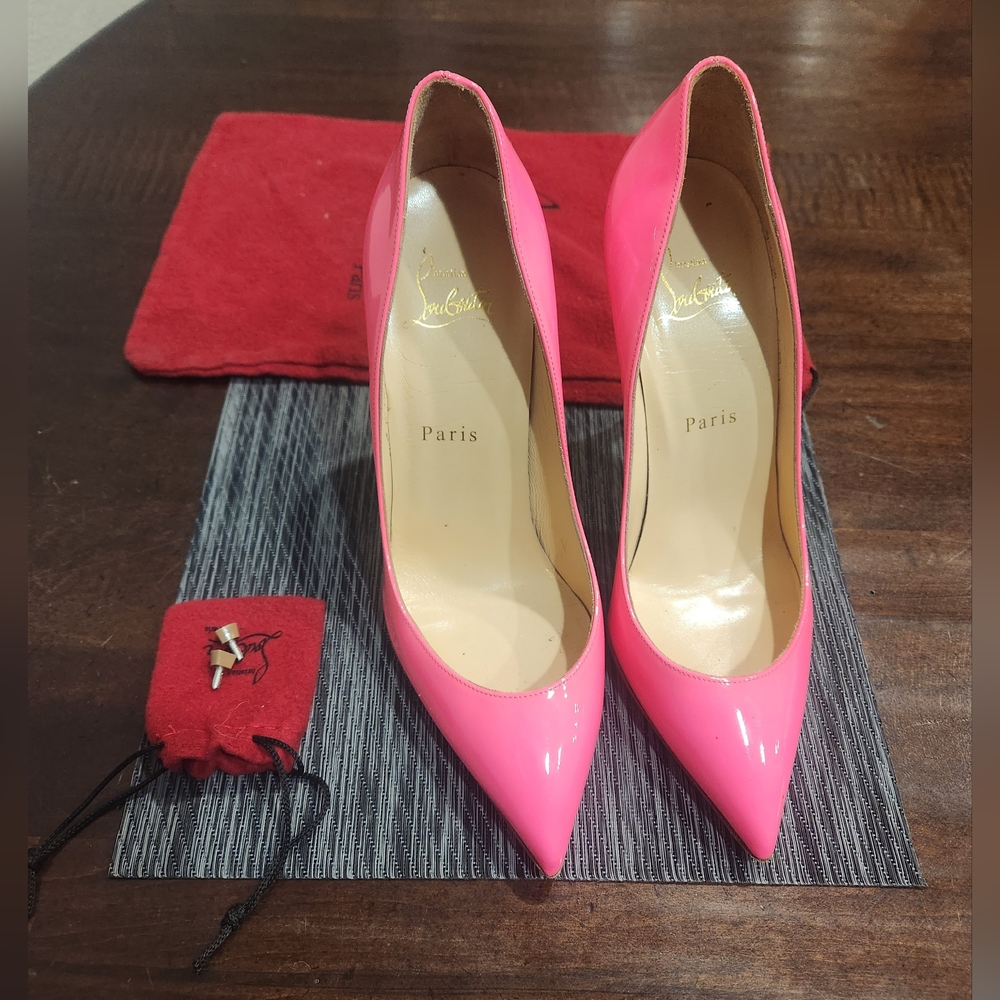 Hot pink Christian Louboutin red bottoms. Sexy.